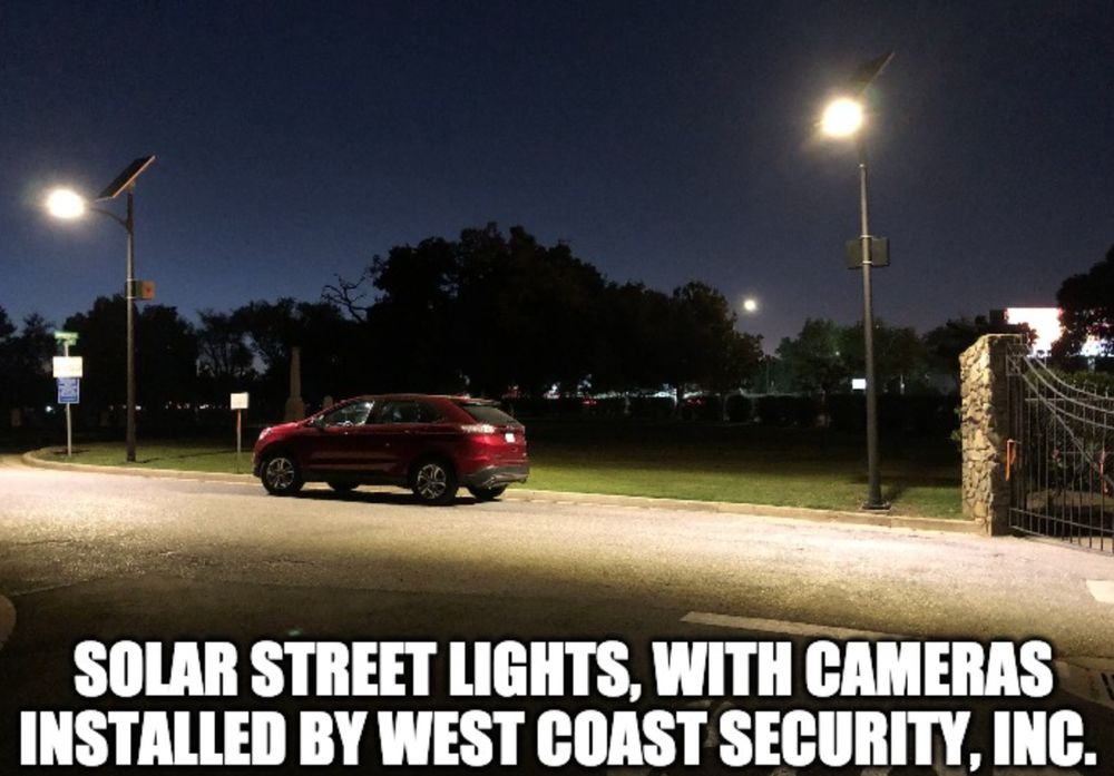 Finished solar street lights with cameras installed along a roadway